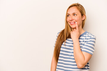 Fototapeta premium Young caucasian woman isolated on white background relaxed thinking about something looking at a copy space.