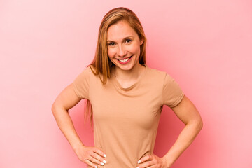 Obraz premium Young caucasian woman isolated on pink background happy, smiling and cheerful.