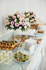 A wide variety of snacks on the table for guests. Shrimp, boiled pork, various types of meat and other products