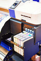 Wide format printer for on fabric and paper