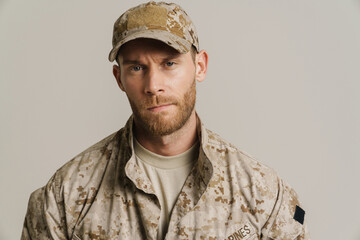 White military man wearing uniform posing and looking at camera