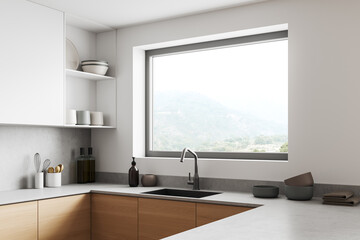 Corner view on bright kitchen room interior with window