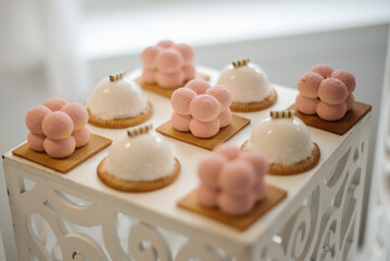 Various desserts and cake on the buffet table at the wedding