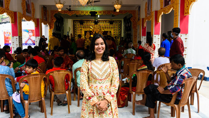 Happy young Bengali woman celebrates Sindur Khela tradition in Durga puja festival. Durga puja...