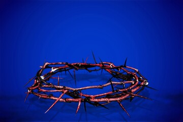 Crown of thorns on dark blue background