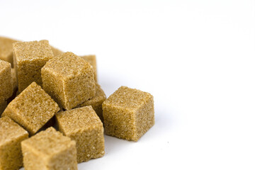Cane sugar on a light background and space for copy. Sugar for healthy desserts and drinks. The concept of health and proper nutrition.