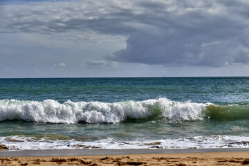 waves in the Praia do Vau beach in Portimao, Algarve, Portugal