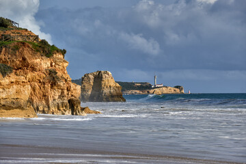 golden cliffs in the Praia do Vau beach in Portimao, Algarve, Portugal