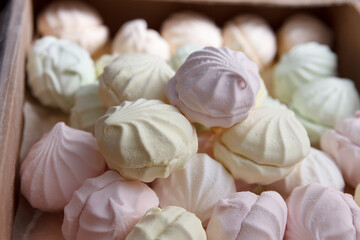 Fresh multicolored marshmallow lies in cardboard packaging prepared for sale in stores