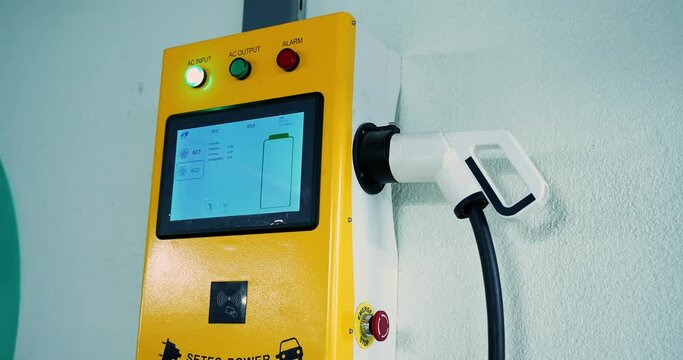 charger for electric vehicles with control panel and connection for the vehicle in the garage