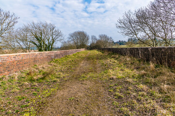 A view across the top of the abandoned Ingarsby Viaduct in Leicestershire, UK in early spring