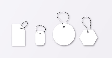 Set of luggage mockup tags isolated on a grey background with string threads, rectangular.