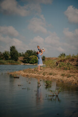 Mother and daughter playing on the lake