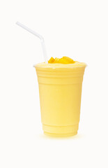 Fresh Mango ripe organic yellow smoothie honey mix with Straw in plastic glass, Garnish isolated on white background. Ripe mangoes are popular all over world. Perfect for summer drink. Healthy food.