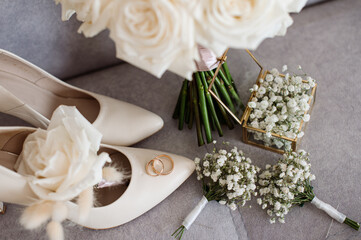 Brides wedding accesories, ring, bouquets and invitation card on flat lay wedding day