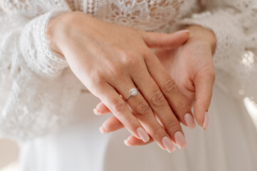 Bride with engagement ring on her finger. Closeup - obrazy, fototapety, plakaty