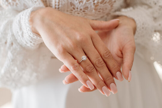 Bride with engagement ring on her finger. Closeup