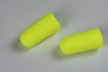 green Ear plugs isolated on white background. yellow  ear plugs isolated