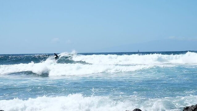 Surfer on waves slow motion
