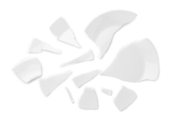 Pieces of broken ceramic plate on white background, top view