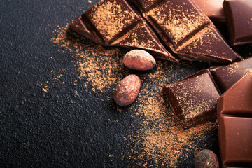 Chocolate and cocoa powder. Composition of cocoa powder, grated and bean cocoa bars and pieces of...