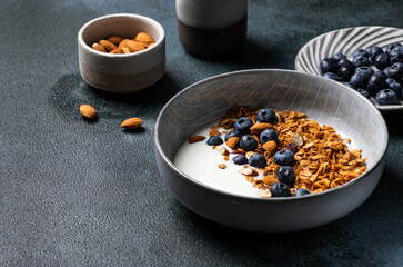 Oatmeal Granola with blueberry. Dry Breakfast. Healthy food or diet concept. Copy space. Granola with greek yogurt. Berry granola with almond. Healthy nutrition. Muesli with berries