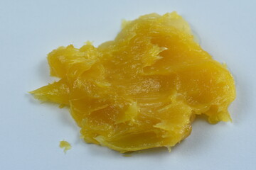 yellow cream on finger ,calendula cream