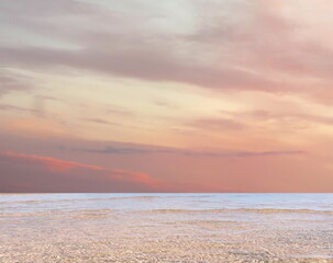 Obraz premium blue sea and cloudy pink sky panorama ,water wave on white sand at the tropical beach summer holiday