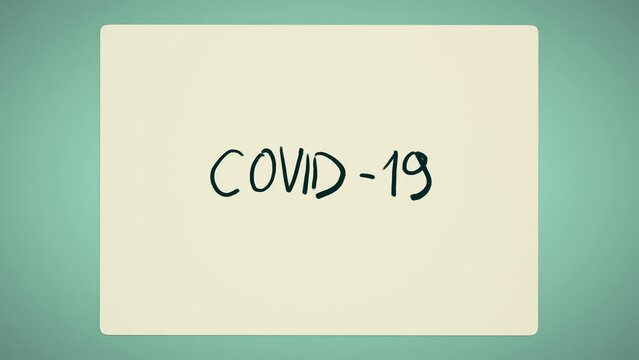 A sheet of paper with the words covid 19 curls into a ball and disappears. Stop-motion animation.
