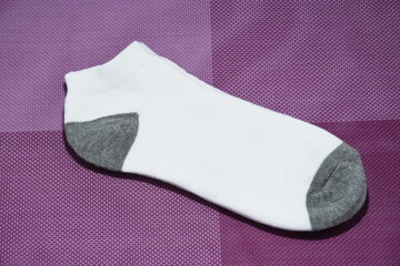 a pair of short white male socks
