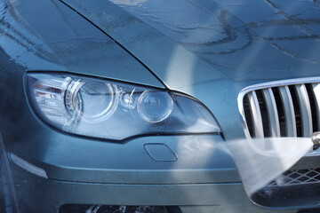 High-pressure washing car outdoors