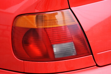 shiny headlight on a car,Tail lights 
