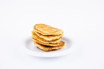 lush tasty fritters on a plate on a white background