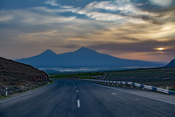 Road and beautiful Mount Ararat. Sunset over the mountain