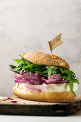 Homemade sandwich with goat cheese and fresh raw vegetables