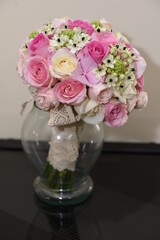 the bride's bouquet with white pink and red rose flowers