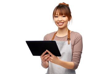 cooking, technology and people concept - happy smiling female chef or waitress in apron with tablet pc computer over white background