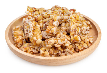 Nut Bars or Peanut Bar in wooden plate isolated on white background, Peanut Bar with Sesame seeds on white With clipping path.