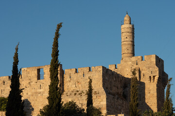 Afternoon view of the landmark, stone Tower of David minaret as golden sunlight strikes the ancient walls of the Old City of Jerusalem. © Yehoshua Halevi
