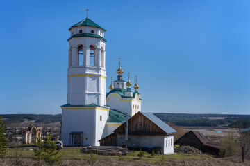 Fototapeta na wymiar A wonderful restored old church in the village of B. Klyuchi (Perm Territory, Russia) on a sunny spring day.