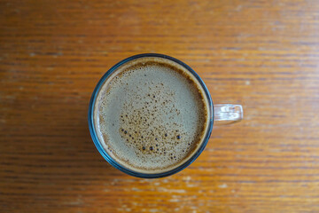 cup of coffee on wooden table
