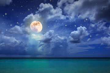 Night stars sky and full moon on Caribbean sea.