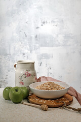 Healthy food concept. Oatmeal and green apples.