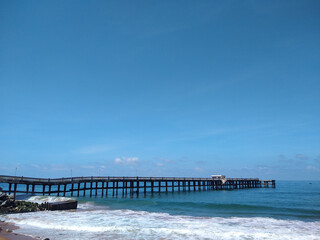 Fototapeta na wymiar Valiyathura sea bridge, Thiruvananthapuram, Kerala, seascape view, blue sky background