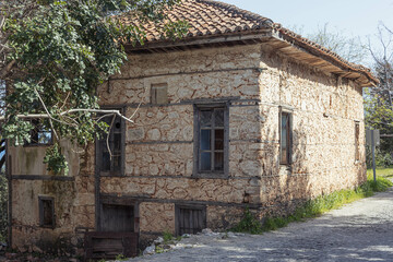 Fototapeta na wymiar old brick house on the road to the park in the village