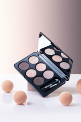 make up palette on nude background, beauty blender sponges