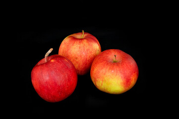 red apple on black background