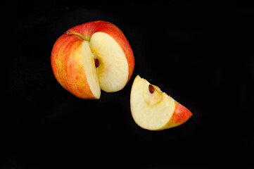 red apple on black background