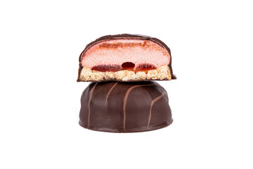 Close-up of a cutaway souffle on a whole souffle over a white background.