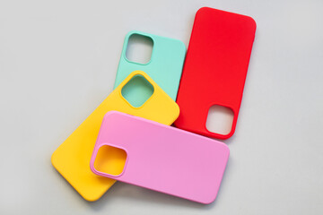 Cases set for smartphone on grey background. Silicone protection for mobile phone. Colorful...